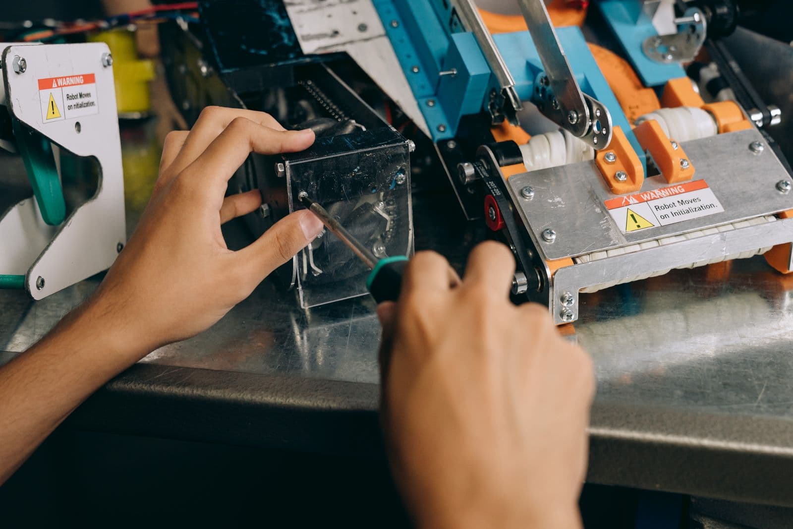 Hands inspecting a precision-machined component